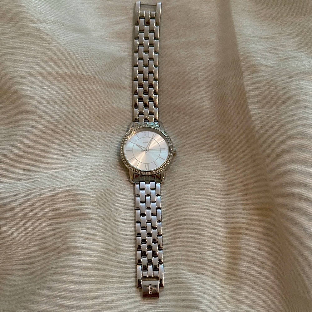 Vintage women’s Timex stainless steel watch with rhinestones around dial